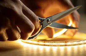 Man cutting a LED strip